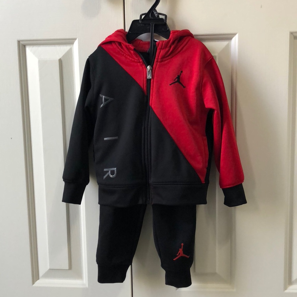 New condition. Jordan black and red jump suit.